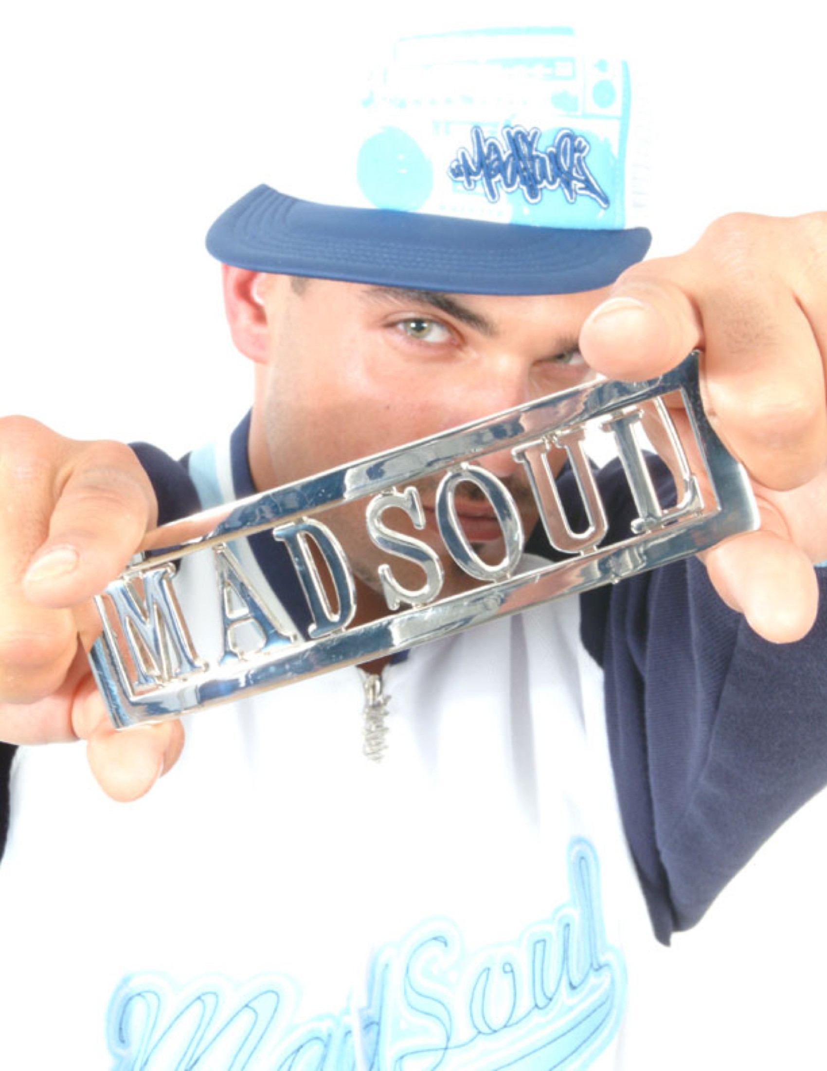 The Madsoul belt buckle, held to camera